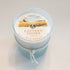 Eastern Shore Candle - Hello Sunshine scent in 6oz container against a white background.  Inside is a dust cover to protect the candle. 